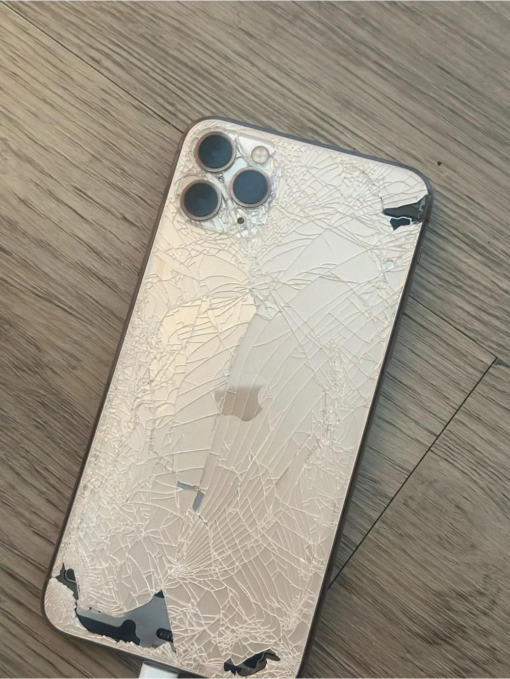 Apple iPhone 11 Pro Max in Gold with Triple Camera - Rear Glass Damage